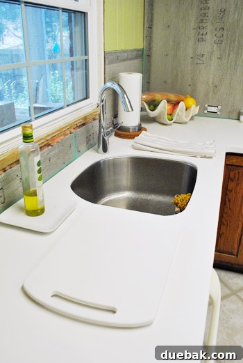 New integrated Corian kitchen sink, clean and ready for use after weeks of renovation without a functional sink.