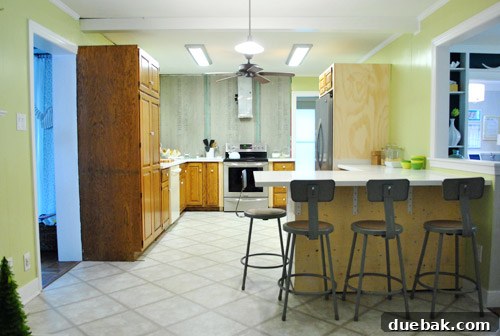 Inspiration photo featuring shiny chrome industrial stools at a kitchen peninsula, showcasing a modern, polished look.