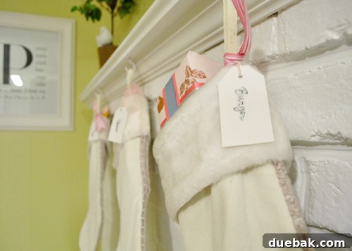 Three Christmas stockings hanging: Mom and Dad, Clara's, and Burger's.