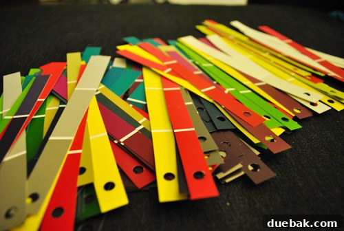 Steps showing paint chips being cut and hole-punched for ornaments.