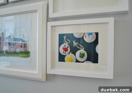 Framed West Elm catalog page with graphic numbered ornaments featuring animals.