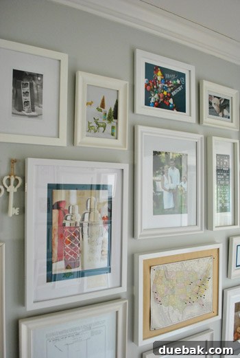 Close-up of framed Martha Stewart glitter ad and a West Elm catalog page featuring a blue star made of ornaments.