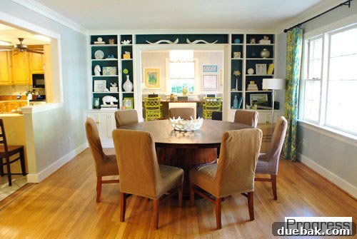 Updated dining room with new lighting and decor, ready for entertaining.