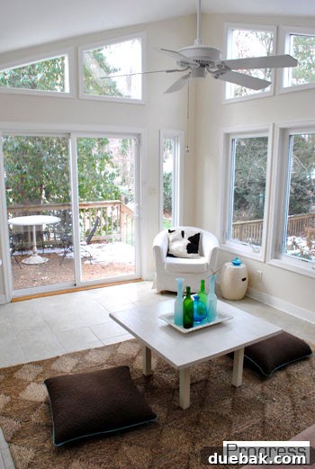 The sunroom, currently used for temporary storage, awaiting its full transformation.
