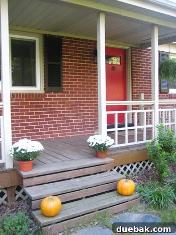 Before: Bright orange fake pumpkins on a porch.