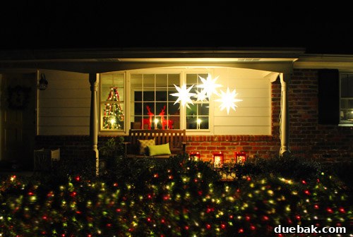 Our Dazzling Outdoor Christmas Display 2 Our charming ranch home adorned with its inaugural outdoor Christmas decorations, glowing warmly at dusk.