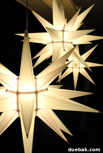Our Dazzling Outdoor Christmas Display 13 A detailed shot showing the assembly process of a Moravian star, with individual spikes being snapped into the central structure.