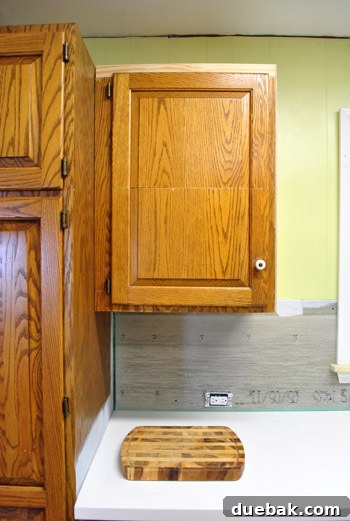 Microwave cabinet door, successfully modified by removing a section from its middle.