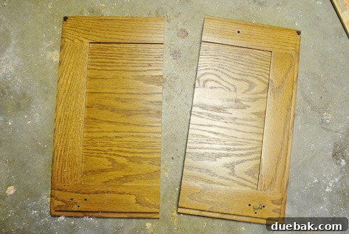Two halves of a cabinet door after cutting out the middle section, ready for rejoining.