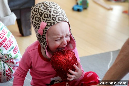 A candid photo of a toddler, Clara, captured in a joyful and playful moment.