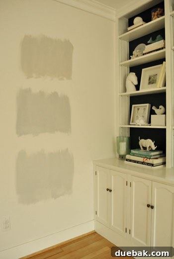 January's Standouts 20 Wall with multiple large swatches of gray paint colors being tested