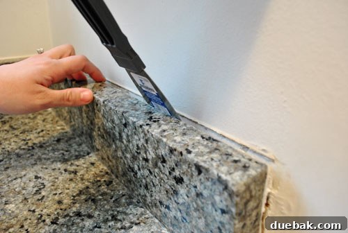 January's Standouts 8 Bedroom sink after removing granite lip, showing a cleaner, furniture-like appearance