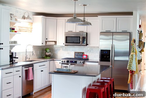 Kitchen with new Silestone countertops and marble subway tile backsplash
