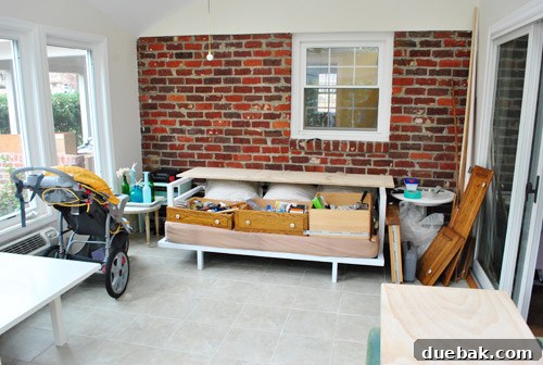 Plywood sheets laid on furniture to create a painting workstation