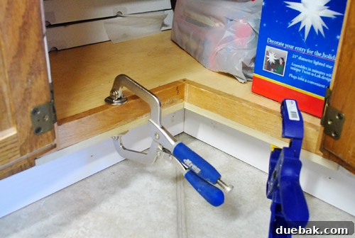 Uneven cabinet frame corrected with wood filler