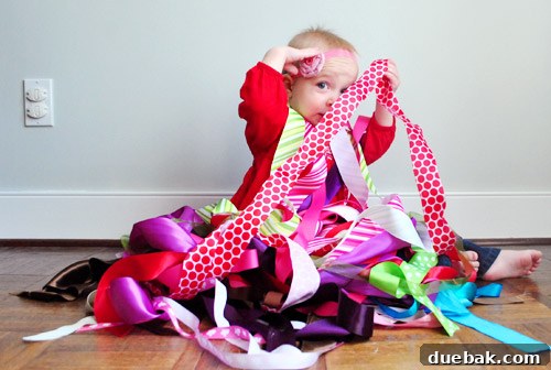 A humorous 'peeper' outtake from a family Christmas photo session, showcasing a toddler peeking playfully.