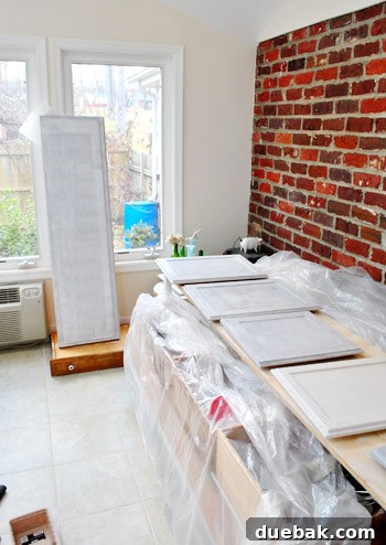 Close-up of a cabinet panel after primer application, ready for paint
