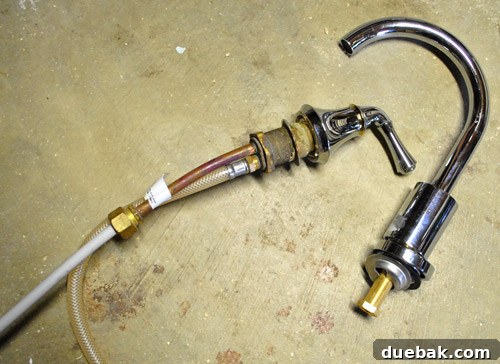 Real kitchen faucet and handle being adapted for play kitchen use