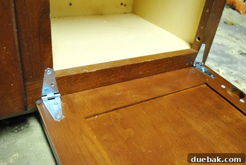 Installing fence hinges on the play kitchen oven door
