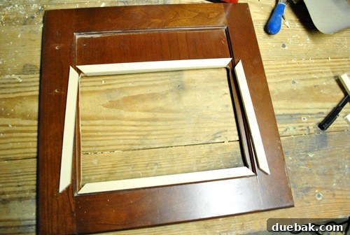 Craft wood being used to create a frame for the oven window