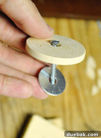 Wooden discs being prepared for play kitchen oven knobs