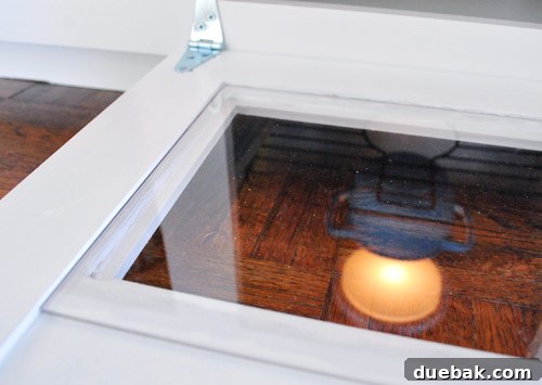 Back view of the plexiglass oven window secured with clear silicone caulk