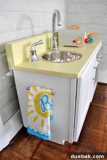 Finished play kitchen with towel bar detail