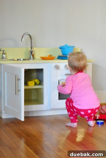 Clara playing with her new homemade play kitchen