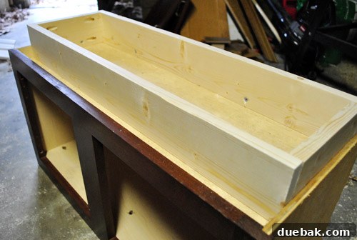 Scrap wood pieces being prepared for the play kitchen countertop and backsplash