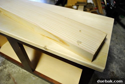 Countertop and backsplash pieces dry-fitted onto the cabinet base