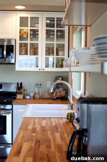 Overall view of the completed open-plan kitchen, showing integrated design