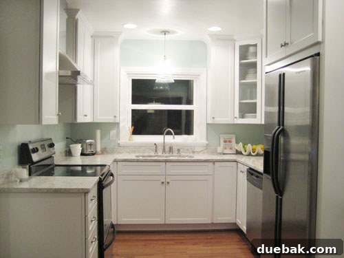 nicekitchen Kitchen styled for a photoshoot with a jute rug, fresh produce, and decorative elements