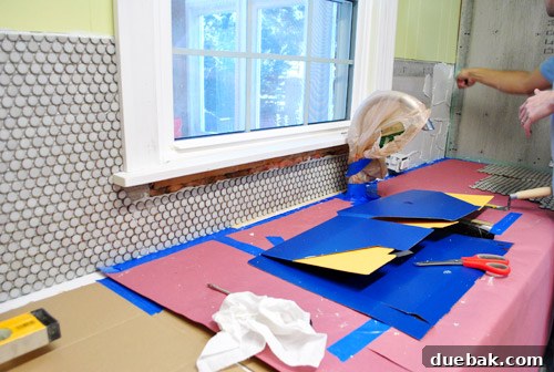 One side of the kitchen backsplash completed