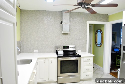 Close-up of the penny tile pattern on the kitchen wall before grouting