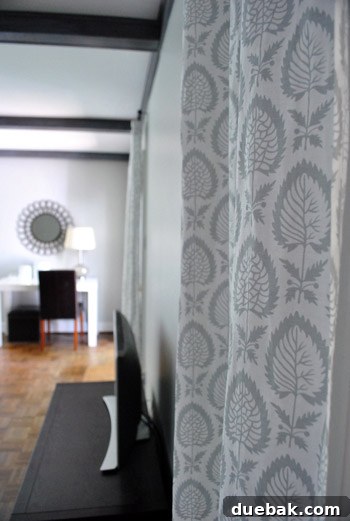 Repurposing Curtain Panels 2 Living room with original patterned IKEA curtains installed, showcasing height and texture.