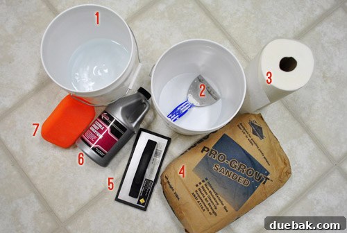 All the tools and materials needed for grouting: buckets, trowel, grout, float, sponge.