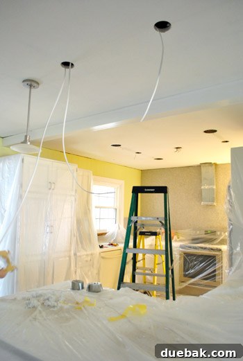 Another perspective of the kitchen mid-renovation, highlighting the ongoing work and temporary setup