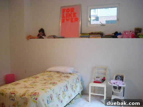 Olivia's room before the makeover - a blank canvas with neutral walls
