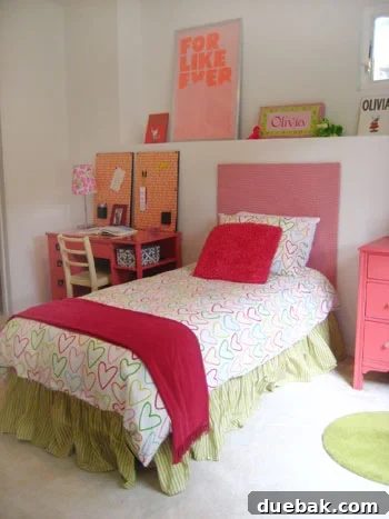 Olivia's room after makeover, featuring the newly painted pink desk