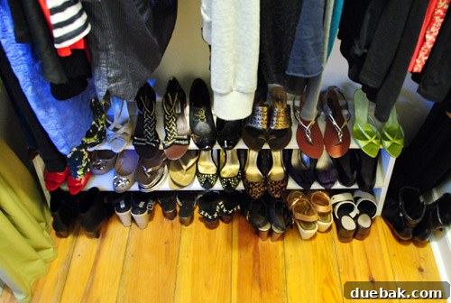 Sherry's side of the closet, overflowing with numerous pairs of shoes.