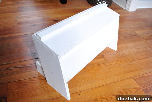 The repurposed shoe rack, now smaller, has been reassembled and placed back in the closet.