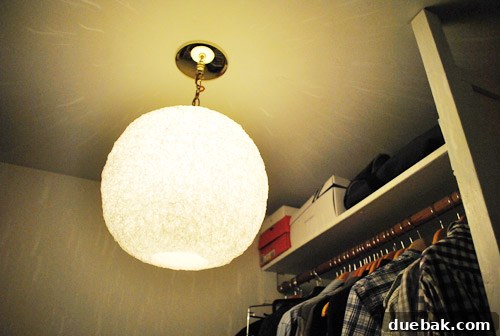 The spaghetti lamp casting beautiful, dancing streaks of light across the closet walls and ceiling.