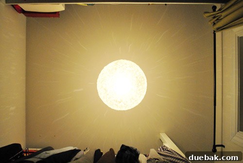 John standing under the installed spaghetti lamp, demonstrating its comfortable hanging height in the closet.