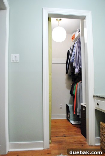 The newly installed vintage spaghetti lamp dramatically improves the lighting and ambiance of the closet.