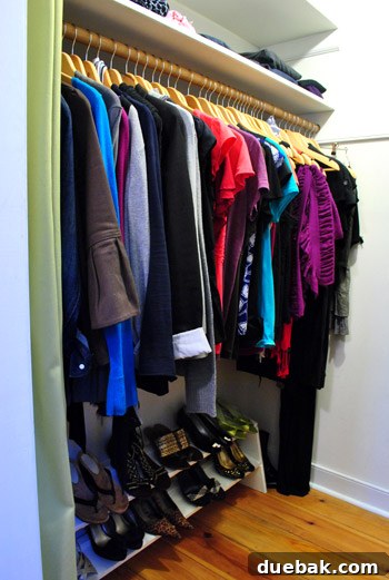 Another angle of the previously organized closet, emphasizing its clean state.