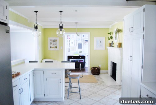 Elevating Kitchen Style with Twin Glass Pendants 9 Another wide shot, showing more of the living area with a large window