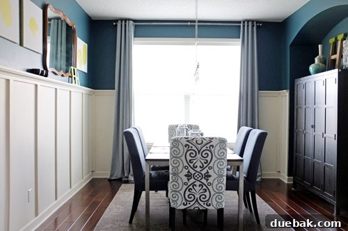 Jackie's beautifully transformed dining room, featuring stunning Plumage teal walls, a large elegant dining table, and stylish, coordinated chairs. The room exudes warmth and sophistication, showcasing the impact of DIY design.