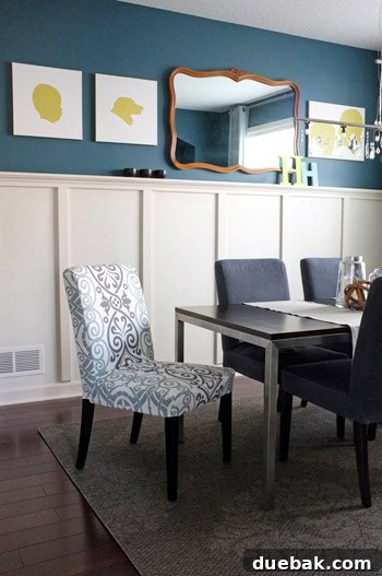 Close-up of a dining chair featuring a beautifully crafted, custom slipcover made from an ordinary tablecloth. The fabric choice and tailoring demonstrate resourceful DIY design, enhancing the chair's elegance and comfort.