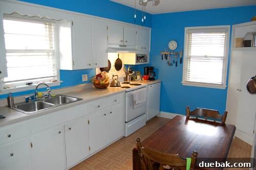 Before kitchen remodel showcasing dated layout and original features of a 1950s ranch house