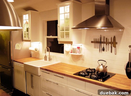 Close-up of kitchen details including reclaimed wood bench and custom slim dining table